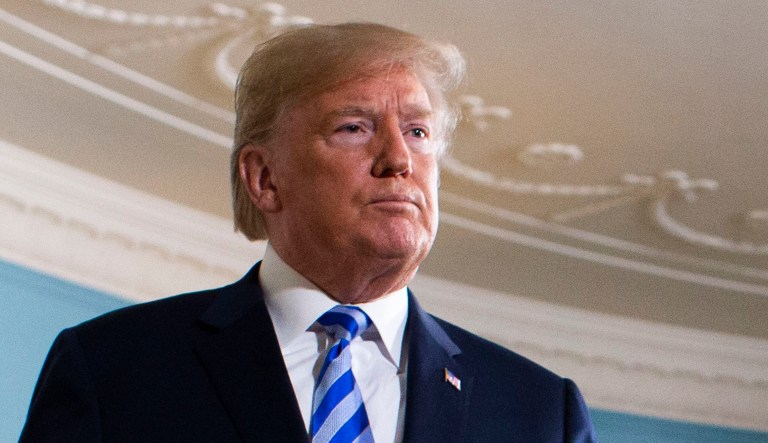 President Trump walks off after delivering a statement on the Iran nuclear deal from the Diplomatic Reception Room of the White House in D.C.