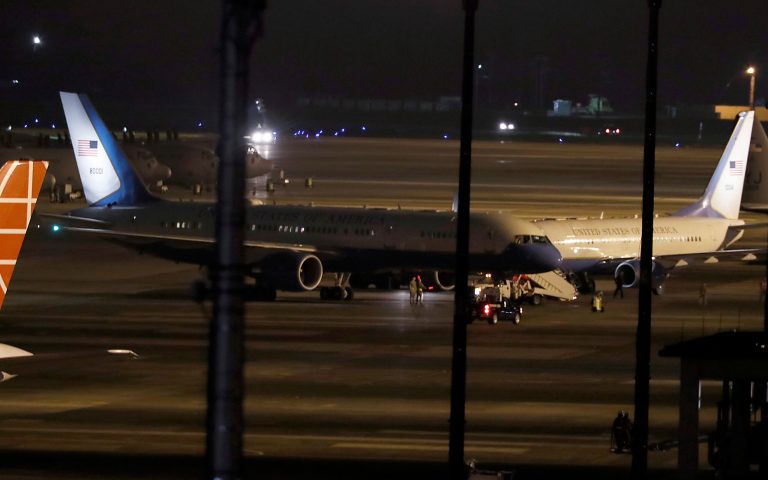 A U.S. government plane, left, lands at Yokota U.S. Airbase in outskirts of Tokyo, Wednesday, May 9, 2018. Three Americans detained in North Korea for more than a year are on their way back to the U.S. with Secretary of State Mike Pompeo, President Donald Trump announced Wednesday in the latest sign of improving relations between the two longtime adversary nations.