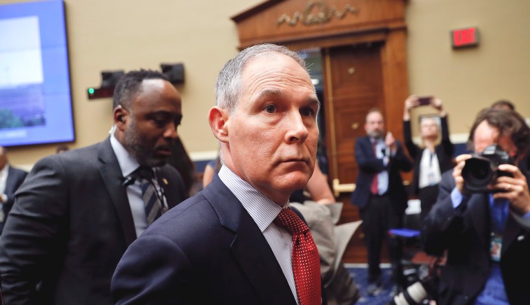 Environmental Protection Agency Administrator Scott Pruitt (pictured center) leaves after a hearing on Capitol Hill in Washington.