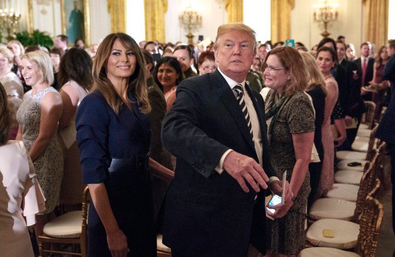 President Donald Trump and first lady Melania Trump walk from the East Room of the White House in Washington, Wednesday, May 9, 2018, at the conclusion of an event celebrating military mothers and spouses. The president signed an executive order addressing military spouse unemployment by providing greater opportunity for military spouses to be considered for federal competitive service positions, and holding agencies accountable for increasing their use of the non-competitive hiring authority for military spouses.