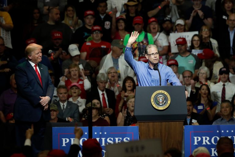 Indiana Republican senatorial candidate Mike Braun, right, acknowledges the crowd and President Donald Trump during a GOP campaign rally Thursday, May 10, 2018, in Elkhart, Ind.