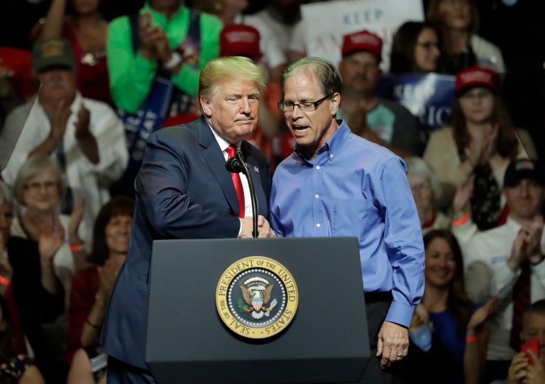 President Donald Trump, left, and Indiana Republican senatorial candidate Mike Braun embrace during a GOP campaign rally. (AP Photo/Charles Rex Arbogast)