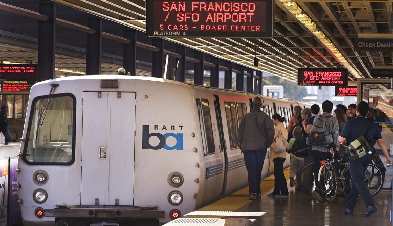  In this Oct. 15, 2013 photo, passengers board a Bay Area Rapid Transit train in Oakland, Calif. 