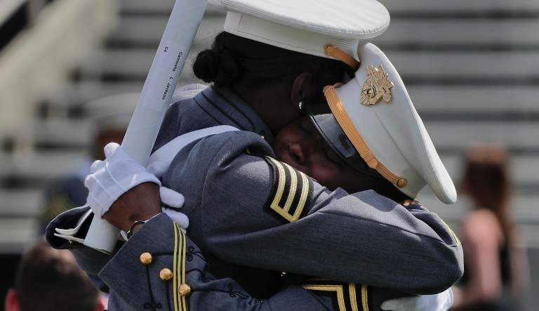 West Point cadets Camiesha Jackson, right, and Courtney Smith hug during graduation ceremonies at the United States Military Academy, Saturday, May 26, 2018, in West Point, N.Y.