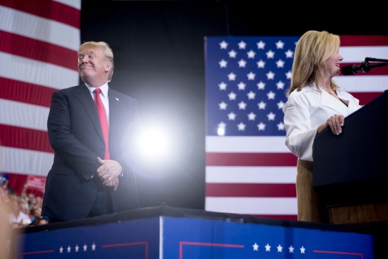 Rep. Marsha Blackburn, R-Tenn., right, accompanied by President Donald Trump, left, speaks at a rally at the Nashville Municipal Auditorium, Tuesday, May 29, 2018, in Nashville, Tenn. 