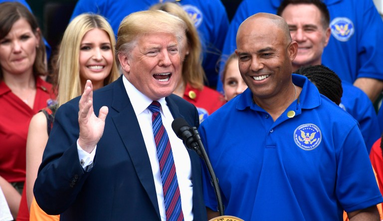 President Trump speaks as he stands next to former New York Yankees relief pitcher Mariano Rivera at the White House Sports and Fitness Day event on the South Lawn of the White House in Washington.