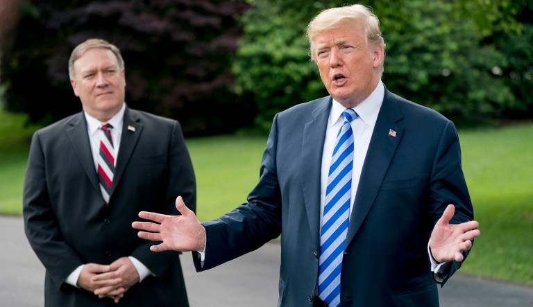 President Donald Trump, right, accompanied by Secretary of State Mike Pompeo, left, speaks to members of the media on the South Lawn outside the Oval Office in Washington, Friday, June 1, 2018, after meeting with former North Korean military intelligence chief Kim Yong Chol. After the meeting Trump announced that the Summit with North Korea will go forward.