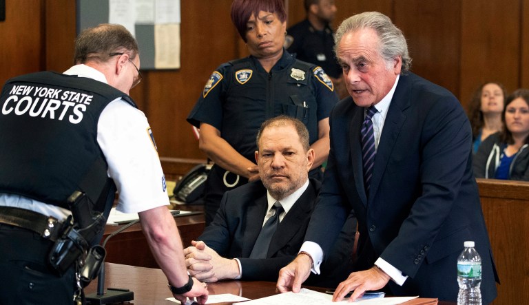 Harvey Weinstein, seated center, listens as his attorney Benjamin Brafman, right, confers with a court officer in New York, Tuesday, June 5, 2018. Weinstein pleaded not guilty to rape and criminal sex act charges in a brief hearing Tuesday before a judge.
