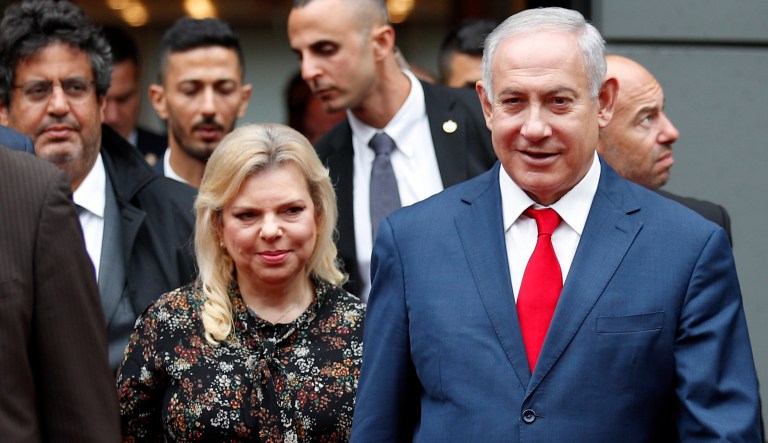 Israel's Prime Minister Benjamin Netanyahu and his wife Sara Netanyahu walk out after their meeting.
