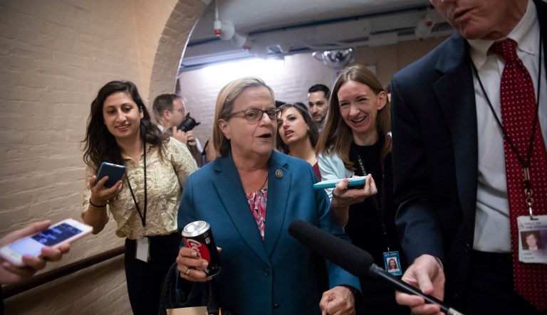 Rep. Ileana Ros-Lehtinen, R-Fla., who was born in Cuba and brought to the U.S. by her parents, is pursued by reporters as she leaves a closed-door GOP meeting in the basement of the Capitol as the Republican leadership tries to reach a policy agreement between conservatives and moderates on immigration, in Washington, Thursday, June 7, 2018.