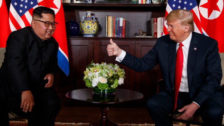 President Trump (right) meets with North Korean leader Kim Jong Un on Sentosa Island, Tuesday, in Singapore.