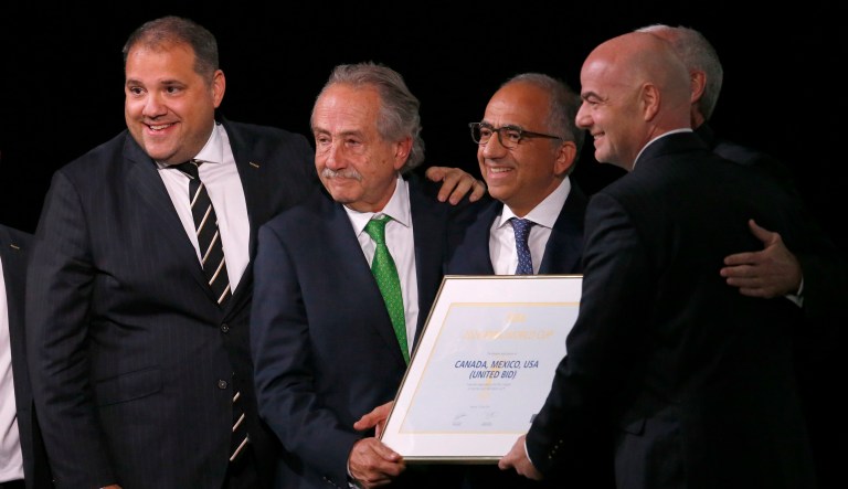 Delegates of Canada, Mexico and the United States celebrate with FIFA President Gianni Infantino, right, after winning a joint bid to host the 2026 World Cup. 