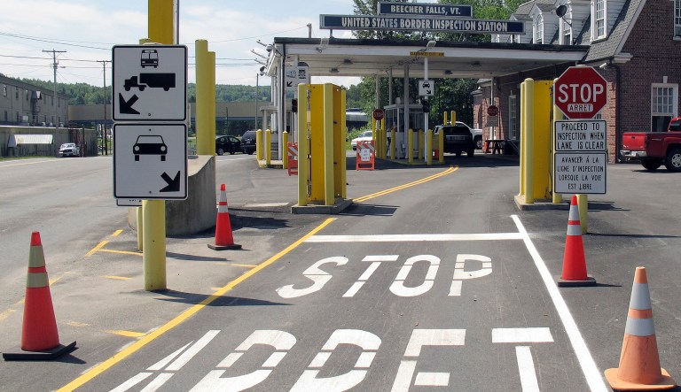 FILE - This Aug. 2, 2017 file photo shows the U.S. border crossing post at the Canadian border between Vermont and Quebec, Canada, at Beecher Falls, Vt. For the first time in decades, one of the world's most durable and amicable alliances faces serious strain as Canadians _ widely seen as some of the nicest, politest people on Earth _ absorb Donald Trump's insults against their prime minister and attacks on their countryâs trade policies. 