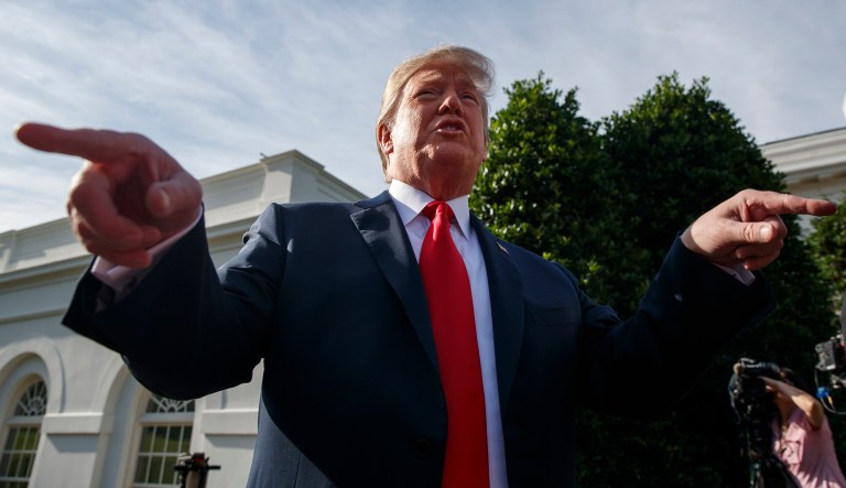 President Donald Trump speaks to reporters on the North Lawn of the White House, Friday, June 15, 2018, in Washington.