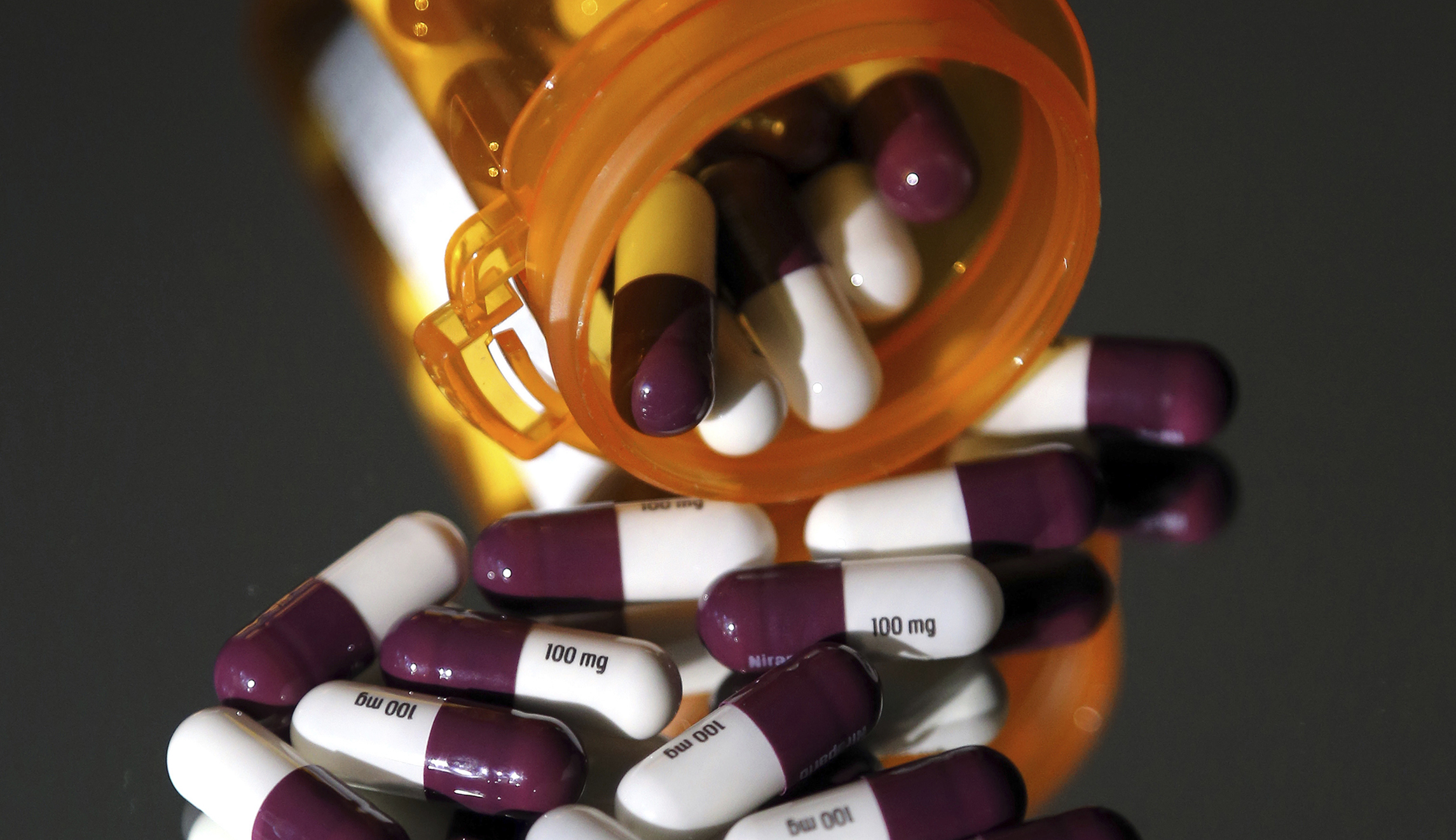 Why must US patients wait for drugs available in other countries?