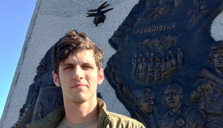 In this June 15 photo, Spenser Rapone stands beside a monument honoring soldiers of the U.S. Army's 10th Mountain Division at Thompson Park in Watertown, N.Y. As of Monday, Rapone, who was commissioned as a second lieutenant in the 10th Mountain Division after his graduation from West Point in May 2016, is out of the Army with an "other than honorable" discharge for "conduct unbecoming of an officer," including his social media activities promoting communism and disparaging top U.S. officials. 