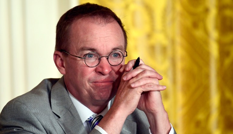Budget Director Mick Mulvaney listens during a meeting in the East Room of the White House in Washington.