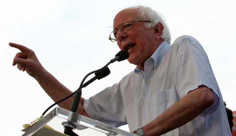 Sen. Bernie Sanders, I-Vt., accompanied by Democrat Ben Jealous, speaks to the crowd during a gubernatorial campaign rally in Maryland's Democratic primary at downtown Silver Spring, Md., Monday, June 18, 2018. 