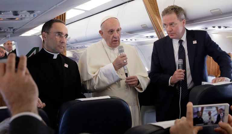 Pope Francis meets the press aboard the plane.