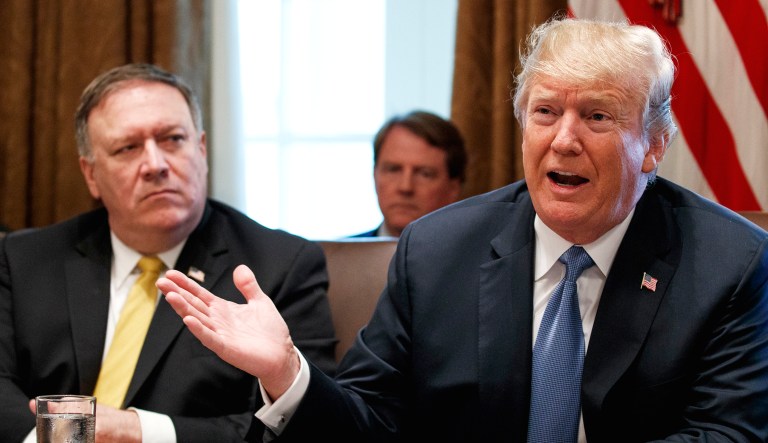 Secretary of State Mike Pompeo (left) listens as President Trump speaks during a cabinet meeting at the White House on Thursday.