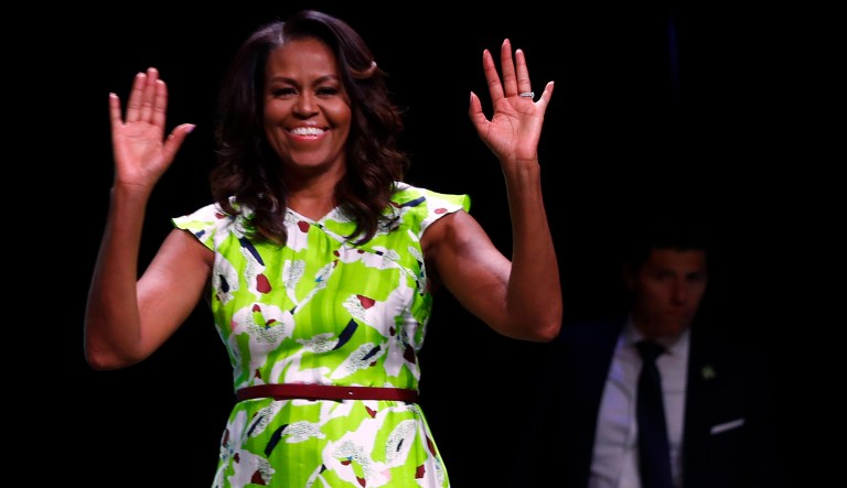 Former first lady Michelle Obama waves as she arrives to speak at the American Library Association annual conference in New Orleans, Friday, June 22, 2018.