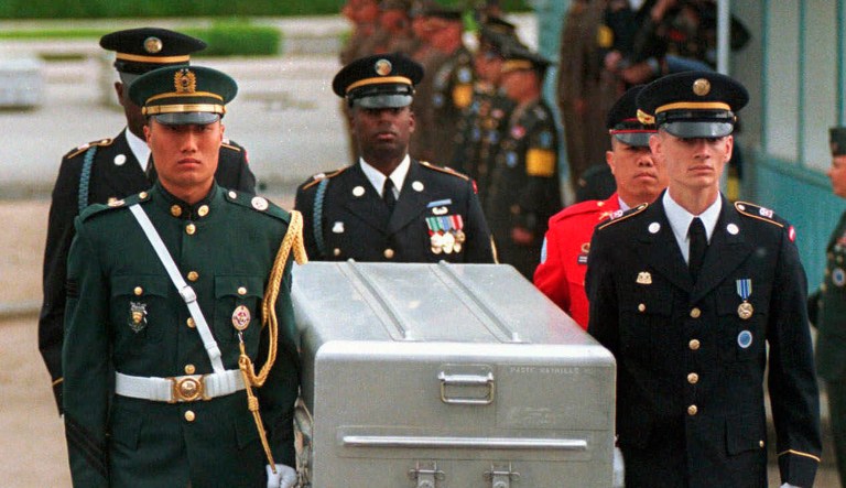  In this May 14, 1999, file photo, U.N. honor guards carry a coffin containing the remains of the American soldiers after it was returned from North Korea at the border village of Panmunjom, South Korea.