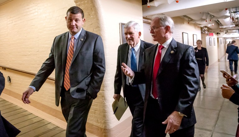 Rep. David Valadao, R-Calif., Rep. Daniel Webster, R-Fla., and Rep. John Rutherford, R-Fla., walk to a closed-door GOP strategy session at the Capitol in Washington, on Tuesday.