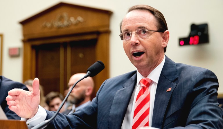 Deputy Attorney General Rod Rosenstein, right, accompanied by FBI Director Christopher Wray, left, testifies before a House Judiciary Committee hearing on Capitol Hill in Washington on Justice Department and FBI actions around the 2016 presidential election.