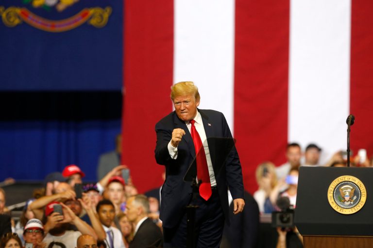 President Donald Trump pumps a fist after speaking at a campaign rally Wednesday, June 27, 2018, in Fargo, N.D.