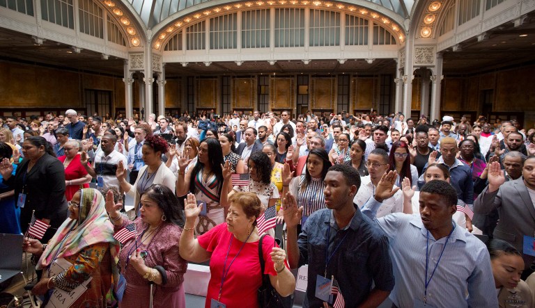 Two hundred immigrants from 50 countries take the oath of citizenship in a naturalization ceremony. 