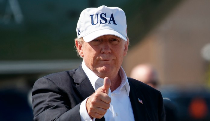 President Trump give the thumbs-up as he boards Air Force One.