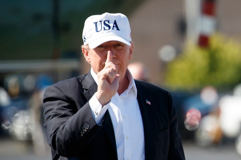 President Donald Trump gestures as he walks from Marine One to board Air Force One at Morristown Municipal Airport, in Morristown, N.J., Sunday, July 8, 2018, en route to Washington.
