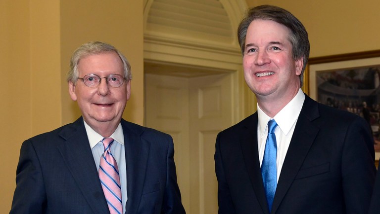 Senate Majority Leader Mitch McConnell of Ky., left, poses for a photo with Supreme Court nominee Brett Kavanaugh.