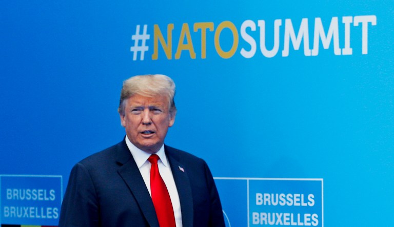 President Trump walks toward NATO Secretary General Jens Stoltenberg before a summit of heads of state and government at NATO headquarters in Brussels on Wednesday. NATO leaders gather in Brussels for a two-day summit to discuss Russia, Iraq and their mission in Afghanistan.