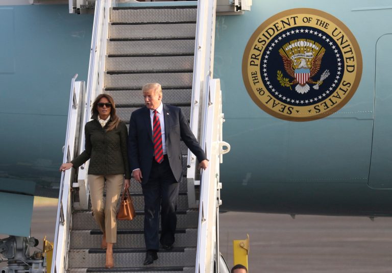 President Trump and first lady Melania Trump disembark from Air Force One as they arrive at Prestwick Airport, in Ayrshire, Scotland, Friday.