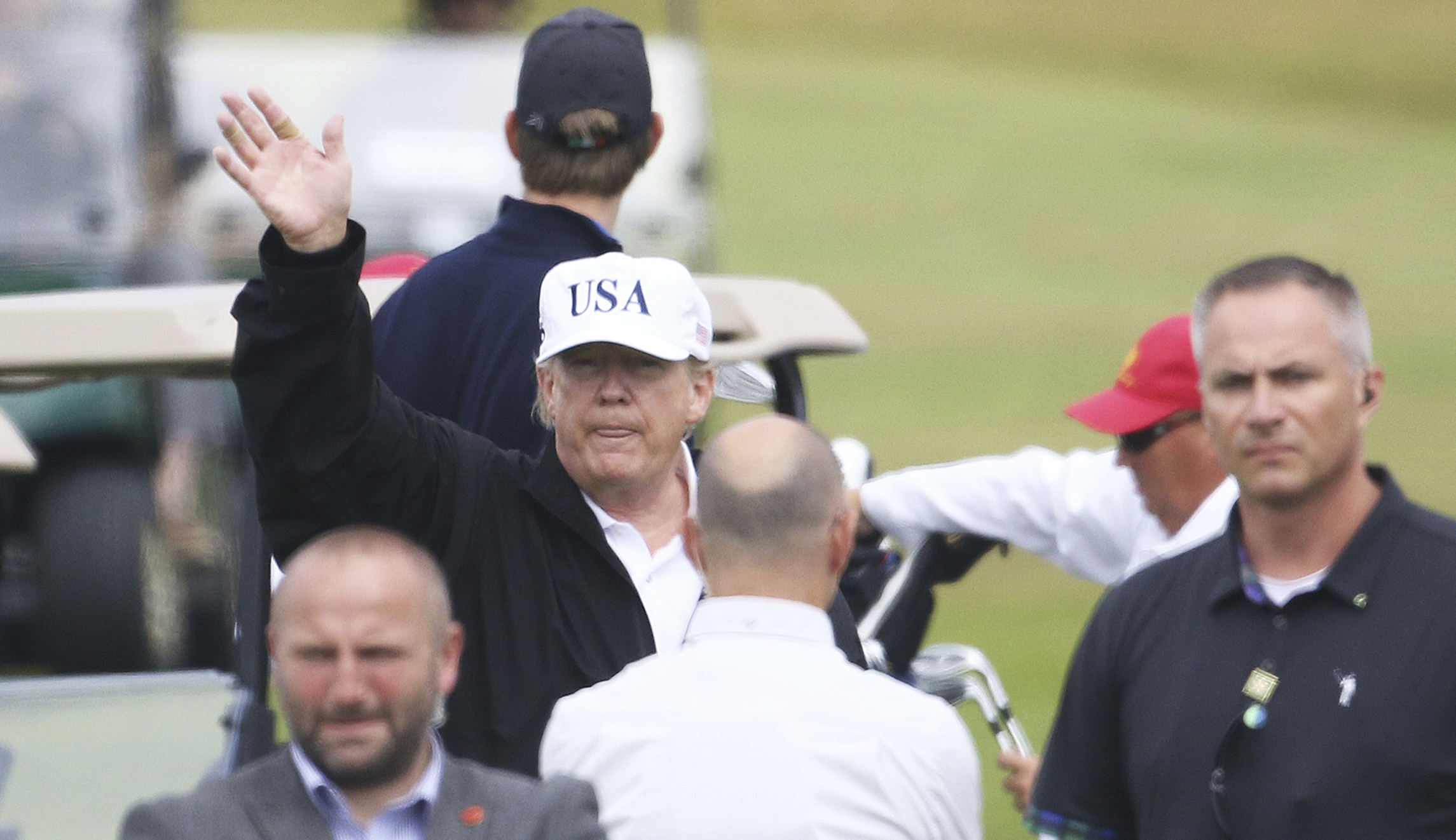 Trump breaks from golf to wave off ‘KKK’ and ‘racist’ chants from Scottish hecklers: WATCH
