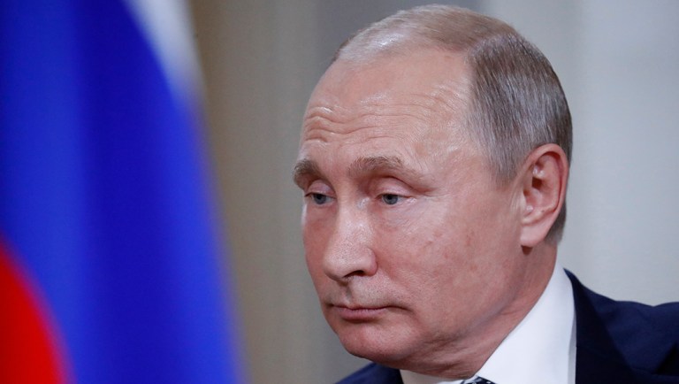 Putin laughs off election interference question