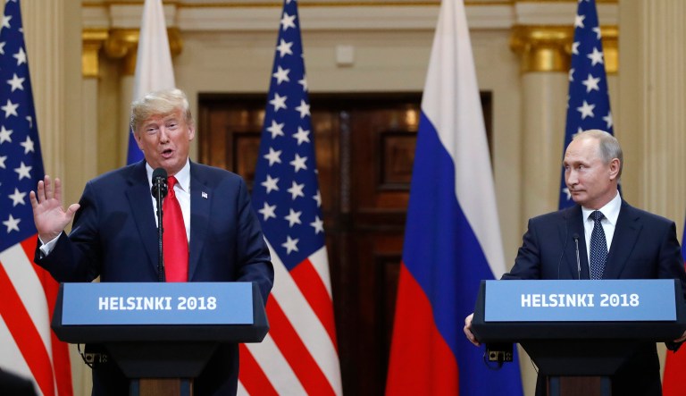 U.S. President Donald Trump, left, speaks beside Russian President Vladimir Putin during a press conference after their meeting at the Presidential Palace in Helsinki, Finland, Monday, July 16, 2018.
