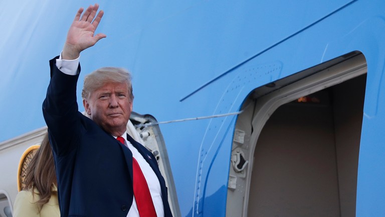 U.S. President Donald Trump waves when boarding Air Force One as he leaves from the airport in Helsinki, Finland, Monday, July 16, 2018, after the meeting with Russian President Vladimir Putin in the Finnish capital.
