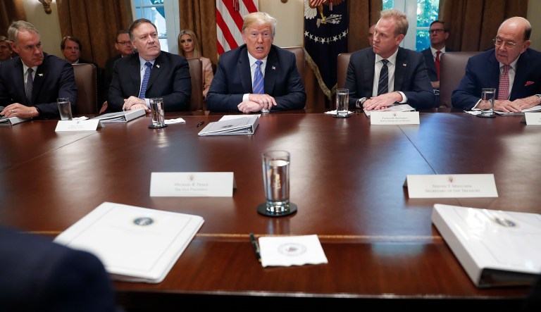 President Donald Trump, center, speak during a meeting with members of his cabinet in the Cabinet Room of the White House in Washington, Wednesday, July 18, 2018. At the meeting are from l-r., Interior Secretary Ryan Zinke, Secretary of State Mike Pompeo, Deputy Secretary of Defense Patrick Shanahan, and Commerce Secretary Wilbur Ross. 
