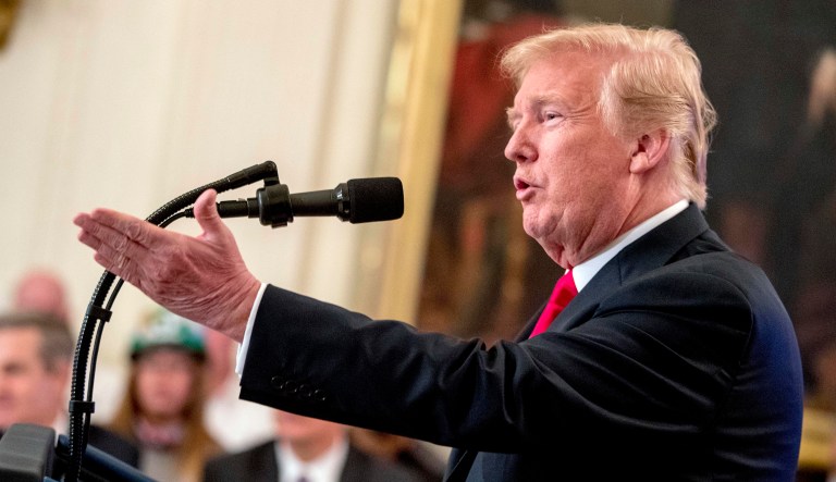 President Trump talks during an event in the White House.