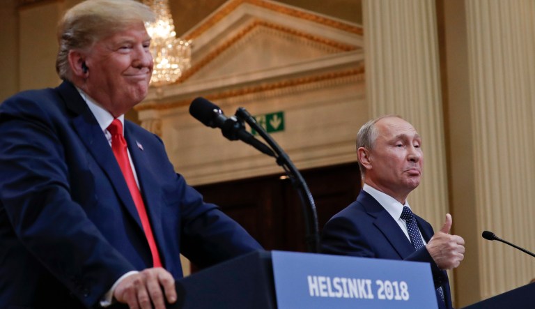 Russian President Vladimir Putin, right, and U.S. President Donald Trump give a joint news conference at the Presidential Palace in Helsinki, Finland, on Monday, July 16, 2018.
