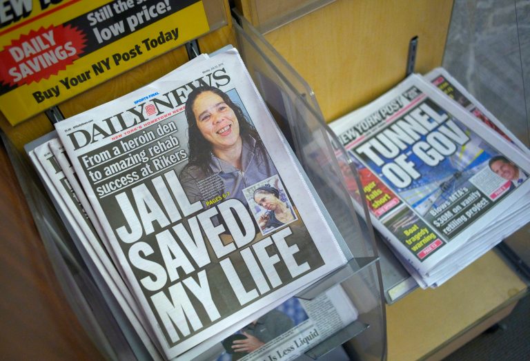 Monday morning copies of the New York Daily News, left, and the New York Post are displayed on a newsstand, Monday, July 23, 2018, in New York. The Daily News cut half of its newsroom staff, saying it will focus more on digital news.