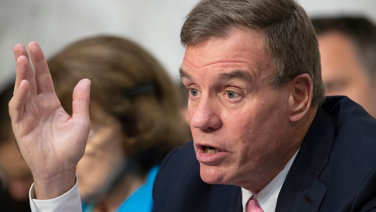 Sen. Mark Warner, D-Va., vice-chair of the Senate Intelligence Committee, questions retired Vice Adm. Joseph Maguire at his confirmation hearing to become the director of the National Counterterrorism Center.