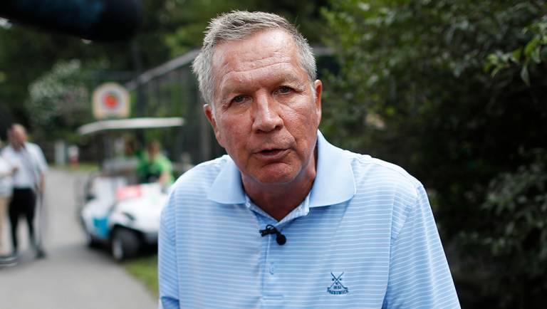 Former Ohio Gov. John Kasich speaks to the media.
