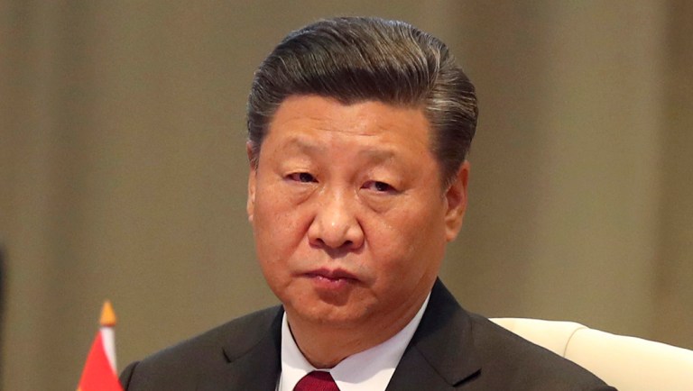 China's President Xi Jinping takes his seat for the first closed session of the BRICS summit, in Johannesburg, South Africa.