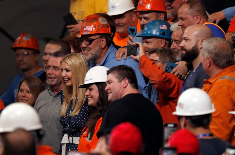 Ivanka Trump poses for a photo with workers at the United States Steel Granite City Works plant Thursday, July 26, 2018, in Granite City, Ill.