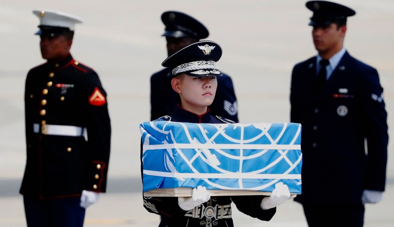 A soldier carries a casket containing a remain of a U.S. soldier who was killed in the Korean War during a ceremony at Osan Air Base in Pyeongtaek, South Korea, on July 27, 2018.