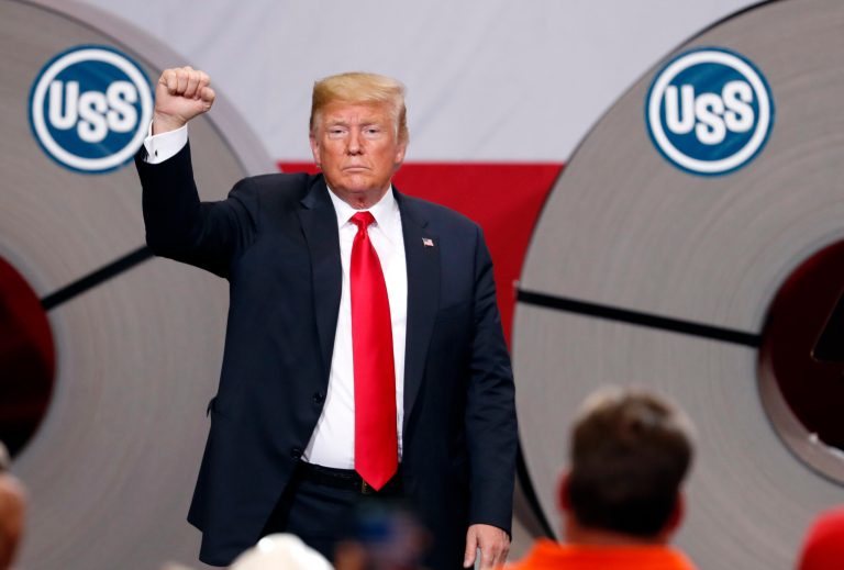In this July 26, 2018, photo, President Donald Trump acknowledges the audience after speaking at the United States Steel Granite City Works plant in Granite City, Ill.