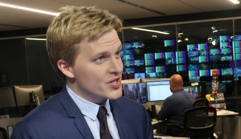 Ronan Farrow, a contributing writer for the New Yorker, speaks with reporters.
